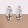 Close-up of silver earrings with center opal stone and micro-set cubic zirconia accents - Silver White / Silver