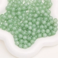 Light green glass jelly beads with drill holes for DIY jewelry making in a white bowl - 6mm (50 Pieces/Pack) / Aventurine Style (Light Green)