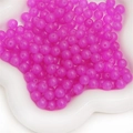 Vibrant magenta semi-transparent glass beads in a white tray for DIY jewelry making - 6mm (50 Pieces/Pack) / Rose Red