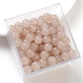 Polished light pink round glass beads in clear box for DIY jewelry making and crafts - 10mm / Brown
