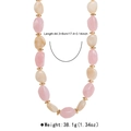 Detailansicht der bunten Harzperlen und Gold-Spacer mit Größen- und Gewichtsangabe - Rosa und weiße zweifarbige Perlenkette (N13114)