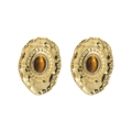 Macro detail of retro gold hammered metal earring with brown stone and crystal halo - Amber