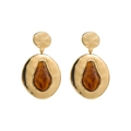 Macro view of gold hammered metal hoop earrings with amber resin pear-shaped inserts - Amber