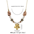 Detailed view of beaded necklace with 40+5cm length and golden flower pendant - Five-Petal Flower