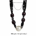 Detail of leopard print silk scarf necklace with wooden beads and a large faux pearl - Black