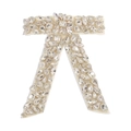 Dettaglio del fermaglio per capelli a fiocco con strass scintillanti e base in raso bianco - Bianco