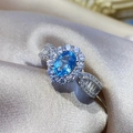 Elegant silver open ring featuring an oval blue topaz center stone with diamond halo - Ljz-106 / Adjustable Open