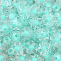 Macro shot of mint green acrylic flower beads with clear petals and threading holes - 50 Pieces / Green