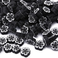 Détail des perles de fleurs en argile polymère noir et blanc pour bijoux artisanaux - 30 Pièces/Paquet (10x4mm) / Noir