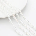 Macro view of transparent faceted glass tower beads arranged in rows for DIY jewelry making - 7x4mm (68 Pieces/Pack) / White