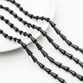 Macro shot of black faceted teardrop crystal beads with glossy finish for jewelry making - 7x4mm (68 Pieces/Pack) / Black