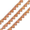 Macro view of heart shaped hematite beads in bronze finish for DIY jewelry making - 6mm / Horizontal Hole Heart Style / Approx 69 Pieces/Pack / Copper
