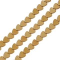 Macro shot of gold-plated heart beads in diagonal rows showing smooth metallic texture - 4mm (Approx 1mm Hole, ~100pcs/Pack) / Electroplated Gold