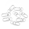 Macro view of 8-piece silver alloy lobster swivel clasps for DIY jewelry making - Silver