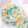Mix of white, orange, and peacock blue ABS imitation pearl beads in a ceramic bowl - 10g/Bag (Approx. 150 Pcs) / Fruitful Harvest Mix