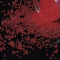 Vibrant red translucent glass micro beads pouring from a bottle for DIY resin art decor - 30g/Pack Diameter 2-3.5mm / Red