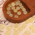 Translucent pale yellow clover beads in a heart-shaped wooden tray for DIY jewelry - 10x10mm (20 Pcs/Pack) / Yellow