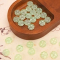 Translucent light green four-leaf clover beads in a heart-shaped wooden tray for DIY crafts - 10x10mm (20 Pcs/Pack) / Light Green