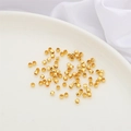 Gefacetteerde 14K vergulde tussenkralen voor DIY-armbanden op een wit keramisch bord - Laserkralen / 10 Stuks/Verpakking (3mm) / 14K Verguld