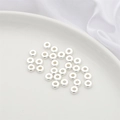 Flat silver plated spacer beads for DIY jewelry making in a white ceramic dish - 10 Pieces (6x2mm) / Silver - Thin Slice Bead