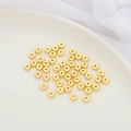 Flat round 14K gold plated spacer beads for DIY jewelry making displayed on a ceramic tray - 10 Pieces (5x2mm) / Gold - Flat Bead