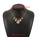 Detail of vintage gold necklace with turquoise pendant and embossed geometric charms - N11632