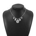 Detail of silver vintage necklace with turquoise pendants on a black neck bust - N11633
