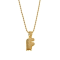 Detailed macro view of the gold-plated letter F pendant with glittering zircon inlay - Letter F
