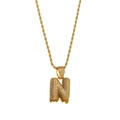 Detail of gold bubble letter N pendant with white and orange zircon on rope chain - Letter N