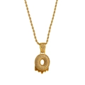 Macro shot of gold hip-hop doughnut pendant with cubic zirconia and melting oil detail - Letter O