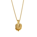 Detail of gold rope chain necklace with heart pendant and dripping orange zircon accents - Letter U