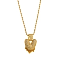 Close-up of golden bubble-style heart pendant with V letter and sparkling crystals - Letter V