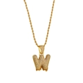 Macro detail of gold hip hop letter W pendant with sparkling zircons and rope chain - Letter W