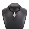 Detail of western style black stone beaded necklace with silver hammered cross pendant - Black
