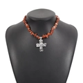 Detail view of Western turquoise stone necklace with silver hammered cross pendant - Agate