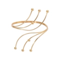 Detailed view of multilayer gold coiled arm cuff with metallic bead accents on a white base - Streamline Branch With Beads / Gold