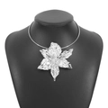 Macro detail of silver floral pendant necklace with hammered metal texture on black mannequin - Lily Shape (N12143) / Silver
