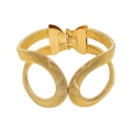 Detail of gold snake-coil spring cuff bracelet with dual ring motif and hinge closure - Gold