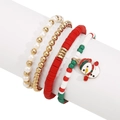 Detalle del juego de 4 pulseras navideñas con dije de muñeco de nieve y cuentas festivas rojas - Muñeco de nieve