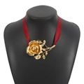 Close-up of a large metallic gold rose pendant with a deep red satin ribbon necklace - Necklace / Red Ribbon Gold Necklace (N12272)
