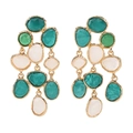 Close-up of bohemian tassel earrings with green resin stones and hammered gold frames - Green