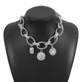 Detail of silver twisted rope chain necklace with vintage coin and relief pendants - Antique Silver