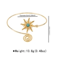 Detail view of adjustable gold arm cuff featuring turquoise stone and spiral design - B3265