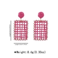 Detail view of pink raffia earrings with dimensions 6.8cm length and crystal border - Rose Red