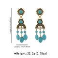 Detail view of ethnic turquoise drop earrings with dimensions 8.3cm by 2.7cm and weight data - E13608
