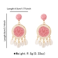 Detail of pink raffia flower earrings with cowrie shell charms and size dimensions - Pink