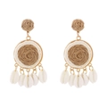Detailed view of bohemian raffia woven earrings with natural shell pendants for summer - Khaki