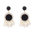 Detail of bohemian raffia hoop earrings with woven texture and small sea shells - Black