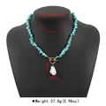 Detail of beaded necklace with turquoise stones, baroque pearl, and gold OT toggle clasp - N12766