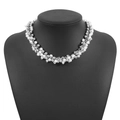 Macro view of cluster pearl necklace with white faux pearls and silver beads on bust - Silver